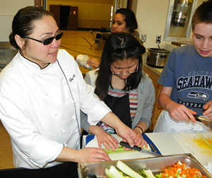 Chef Cabrera shows cutting techniques.